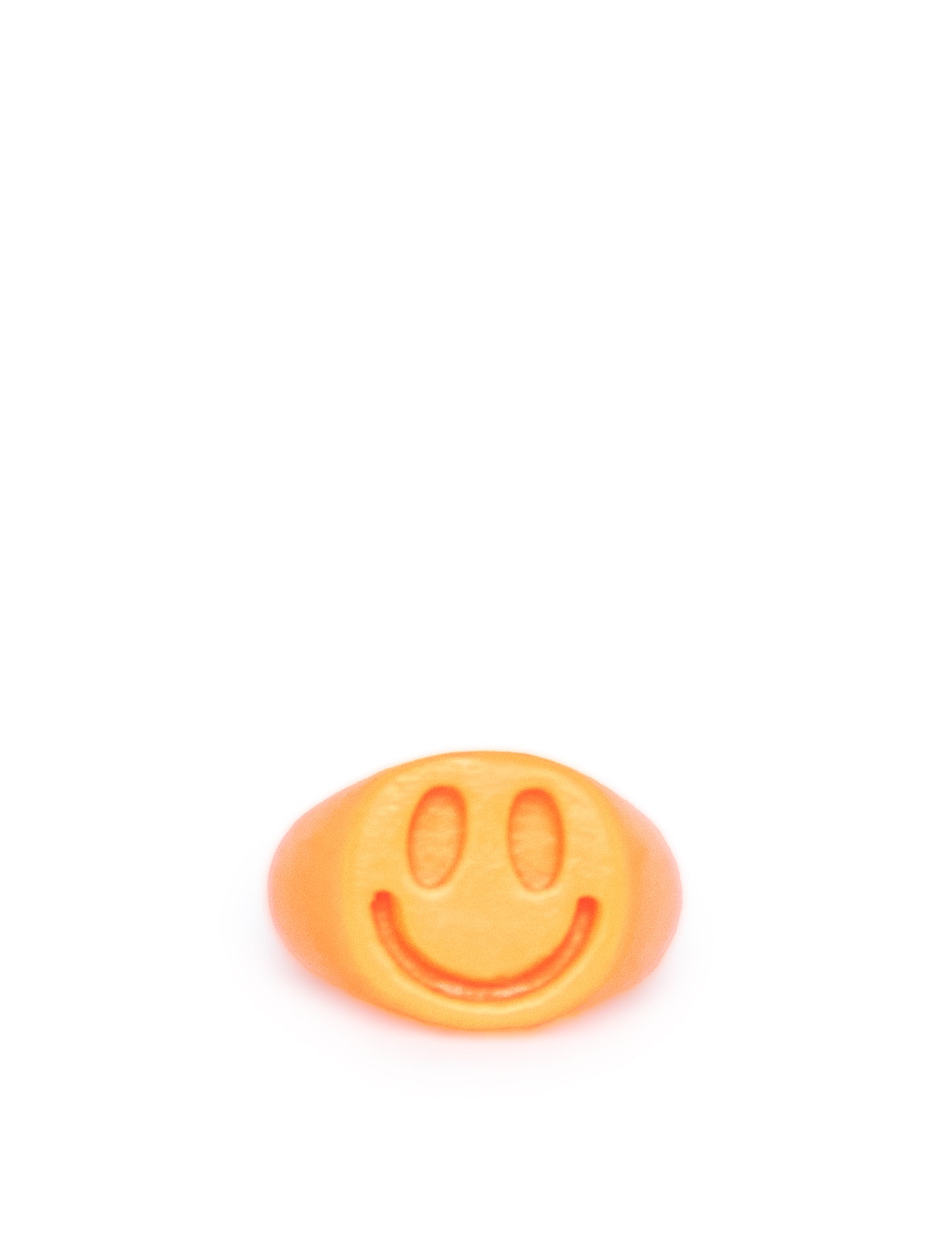 orange plastic smile signet ring